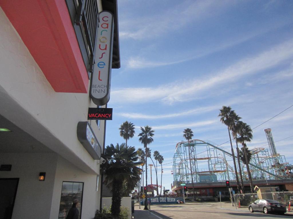 a roller coaster in a parking lot with a roller coaster at Carousel Beach Inn in Santa Cruz