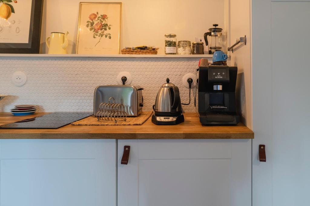 Cuisine ou kitchenette dans l'établissement Le Citron