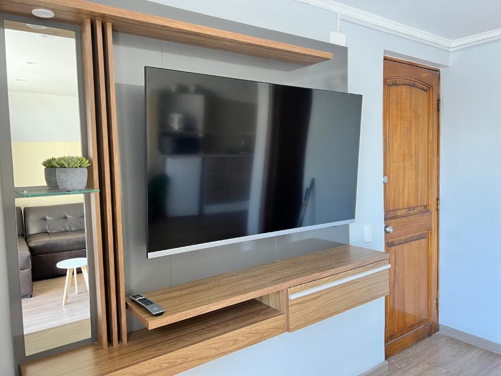 TV a/nebo společenská místnost v ubytování Spazios Apart Hotel Reñaca