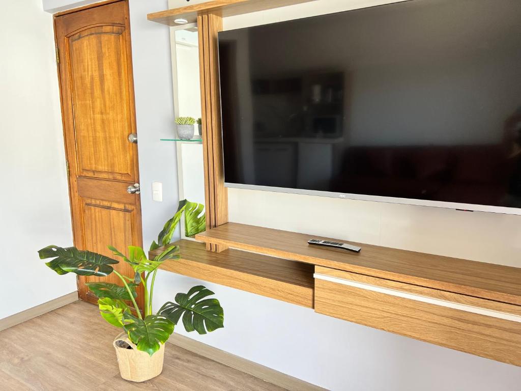 TV a/nebo společenská místnost v ubytování Spazios Apart Hotel Reñaca