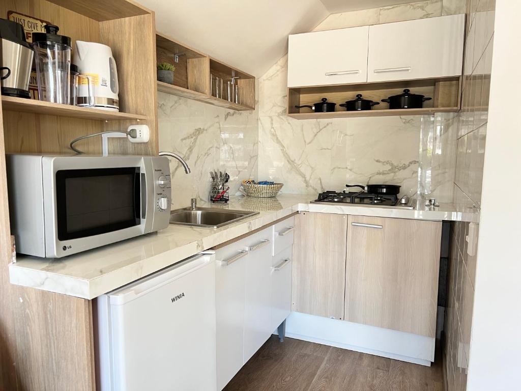 Kuchyň nebo kuchyňský kout v ubytování Spazios Apart Hotel Reñaca