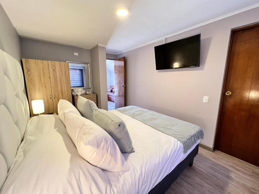 Postel nebo postele na pokoji v ubytování Spazios Apart Hotel Reñaca