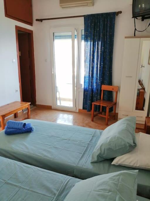 Postel nebo postele na pokoji v ubytování RODON PANDELI APARTMENT in Spilia Leros