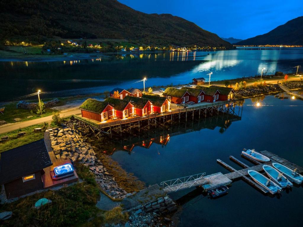 an aerial view of a marina at night at Manndalen Sjøbuer in Samuelsberg