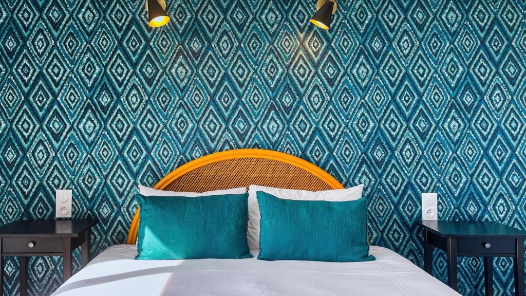 Postel nebo postele na pokoji v ubytování Hôtel l'Albatros