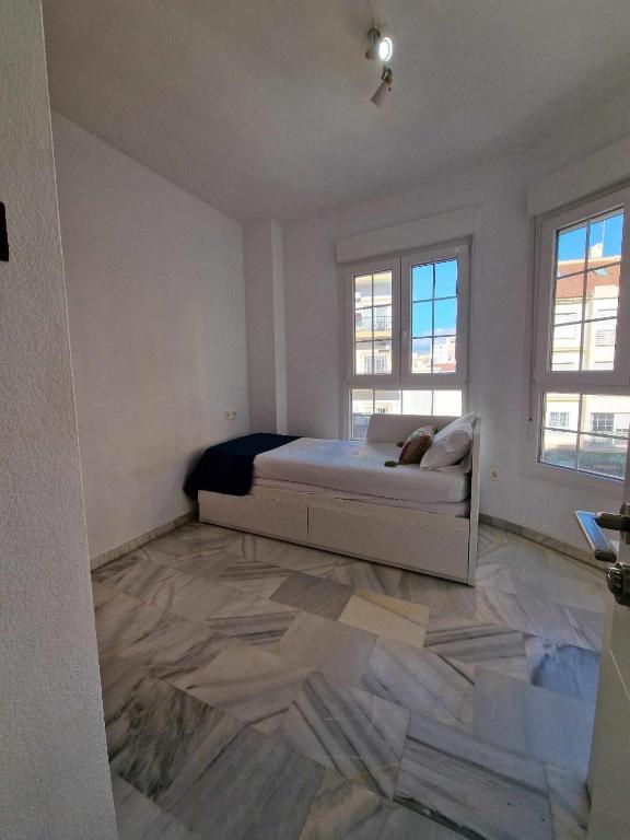Posteľ alebo postele v izbe v ubytovaní Ático moderno con terraza privada en Málaga centro