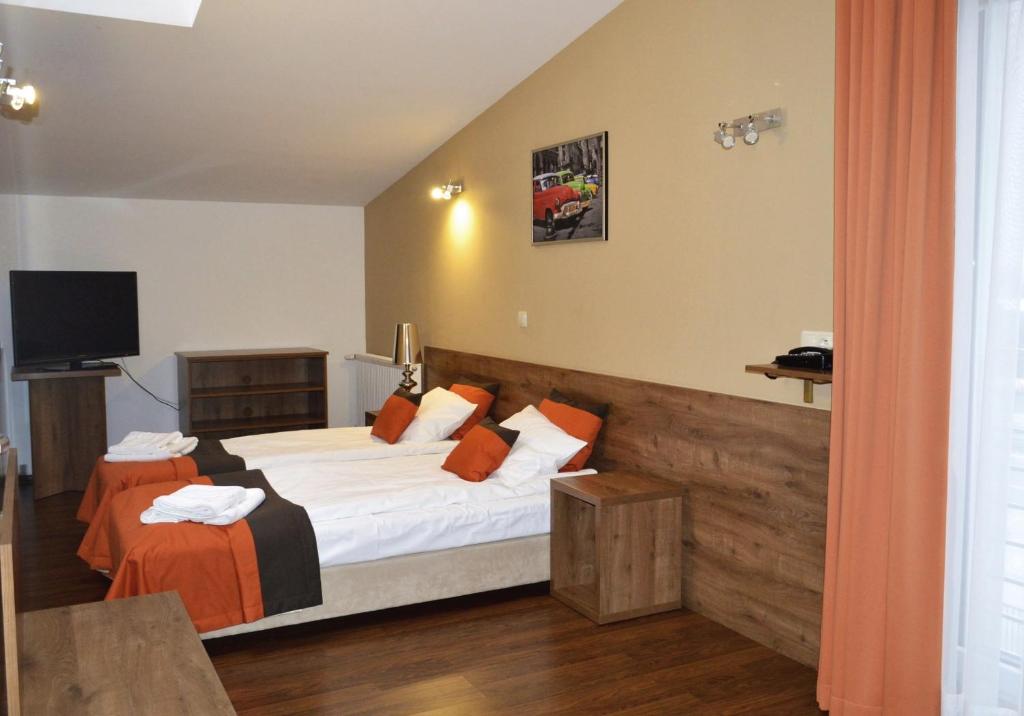 Postel nebo postele na pokoji v ubytování Hotel Ajax