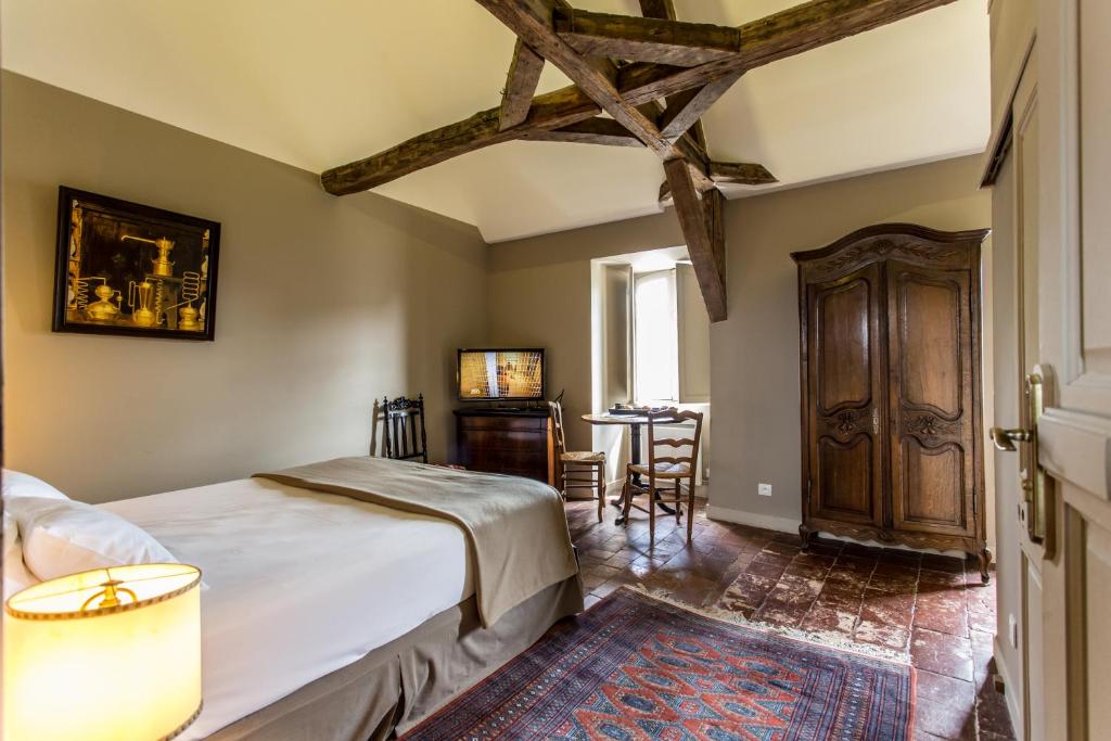 Posteľ alebo postele v izbe v ubytovaní L'hôtel de Panette, charpente historique - cathédrale
