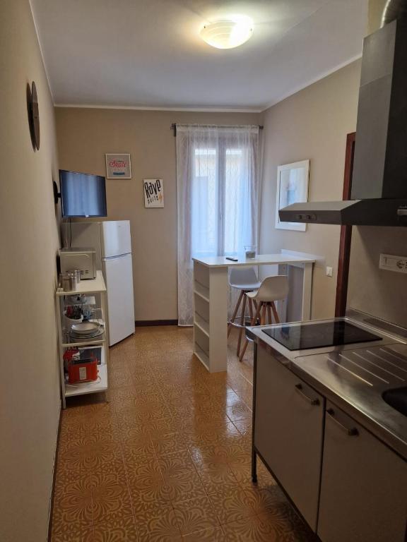 a kitchen with a sink and a counter top at San Pietro Apartment in Padova