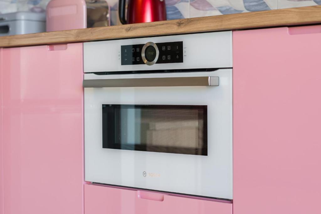 Kuchyňa alebo kuchynka v ubytovaní Bukowska 18 Apartments MTP Poznań by Noclegi Renters