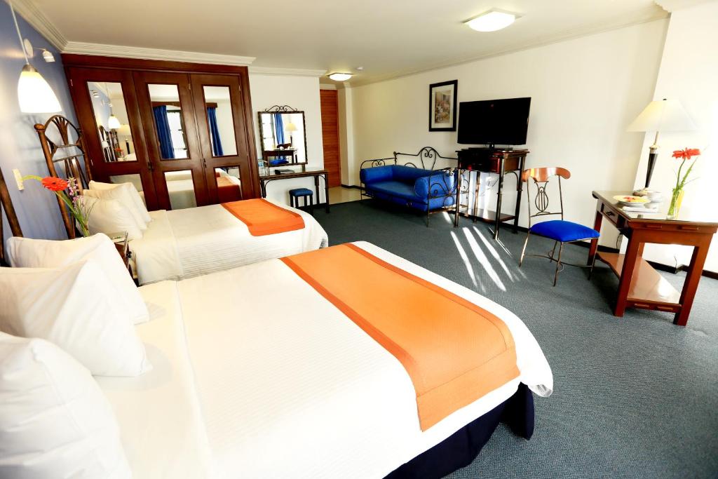 TV a/nebo společenská místnost v ubytování Hotel Ciros