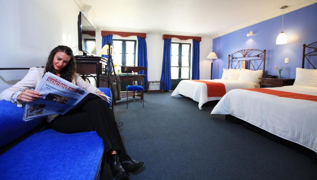 Postel nebo postele na pokoji v ubytování Hotel Ciros
