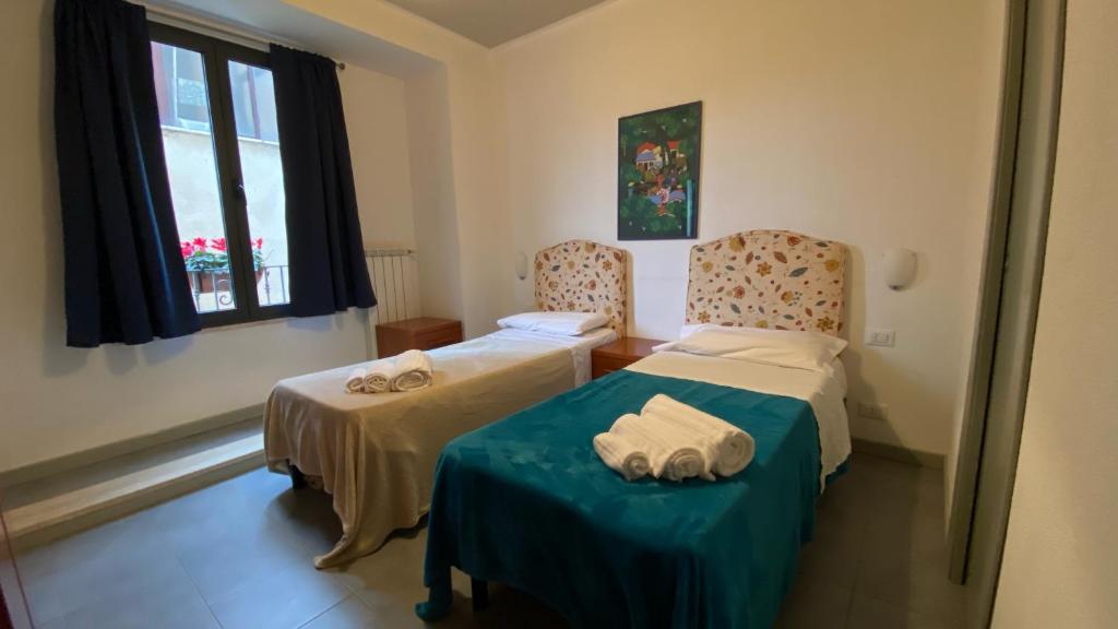 Posteľ alebo postele v izbe v ubytovaní Locanda le GINESTRE