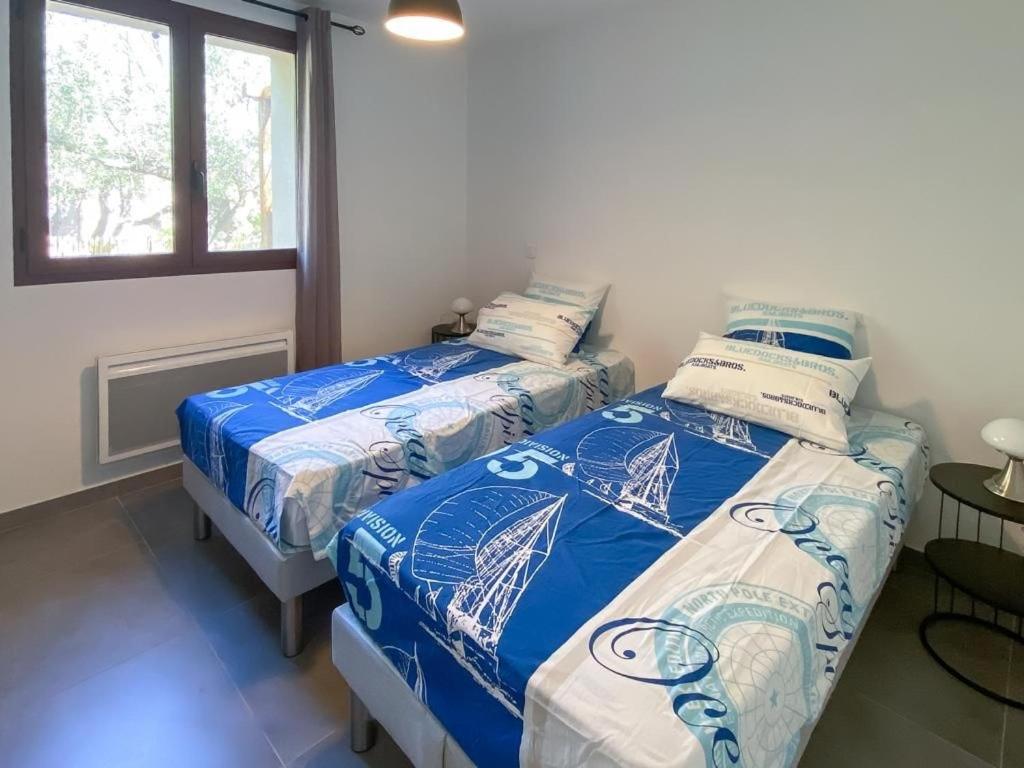 Łóżko lub łóżka w pokoju w obiekcie Villa Colombo