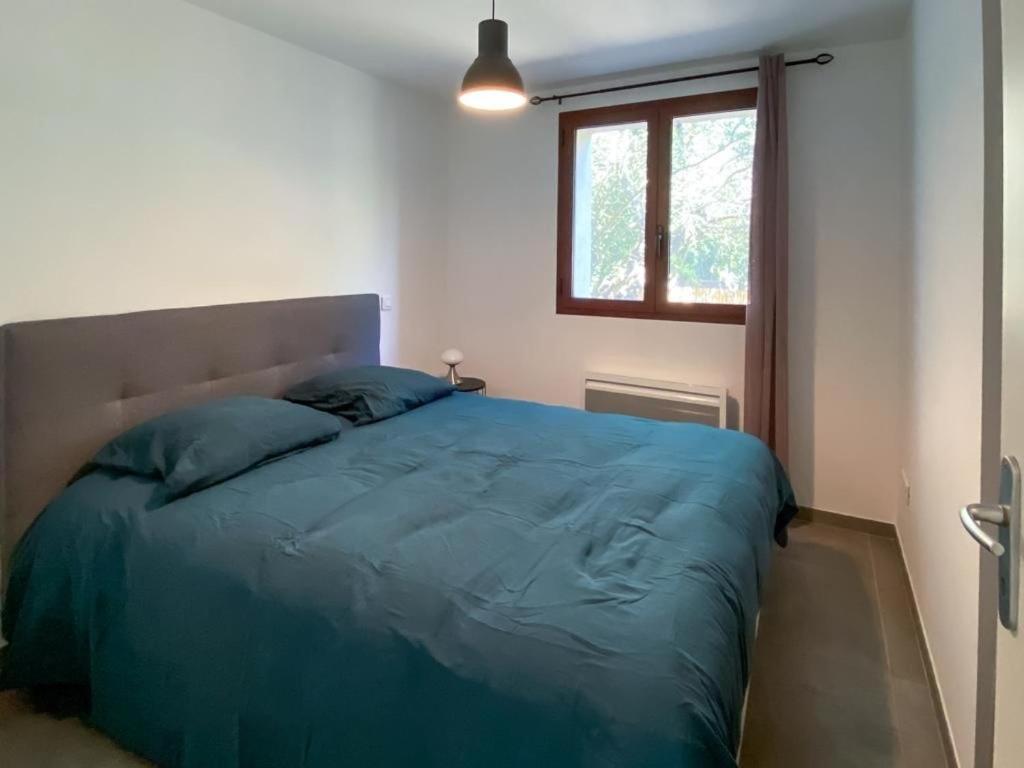 Łóżko lub łóżka w pokoju w obiekcie Villa Colombo
