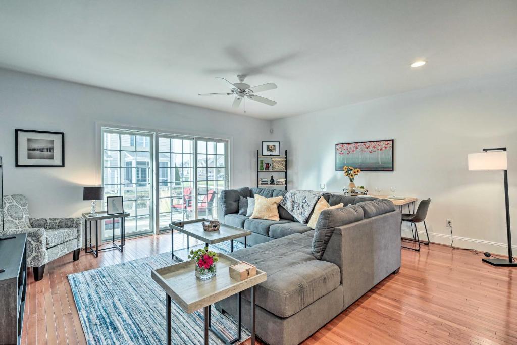a living room with a couch and a table at Patio and Pool Access Rehoboth Beach Retreat in Rehoboth Beach