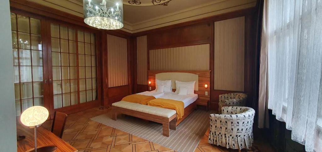 Postel nebo postele na pokoji v ubytování Hotel Okresní Dům