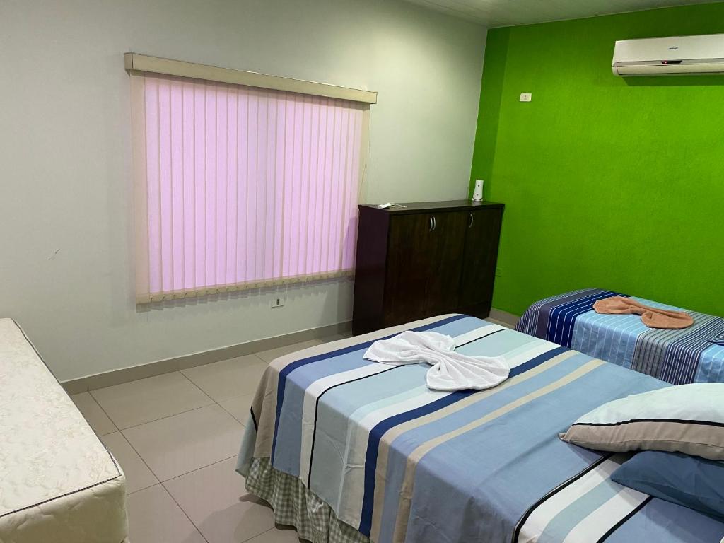 Postel nebo postele na pokoji v ubytování POSADA DON CANDIDO