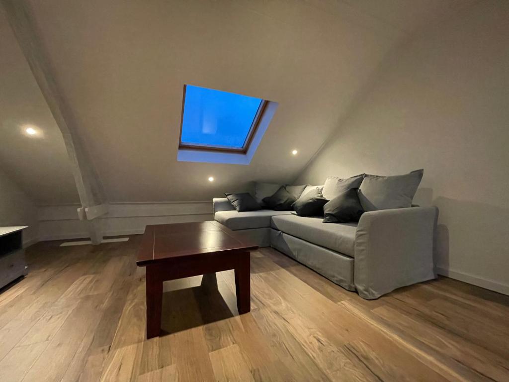 a living room with a couch and a table at TopSleep Apartment 26-3 in Arnhem