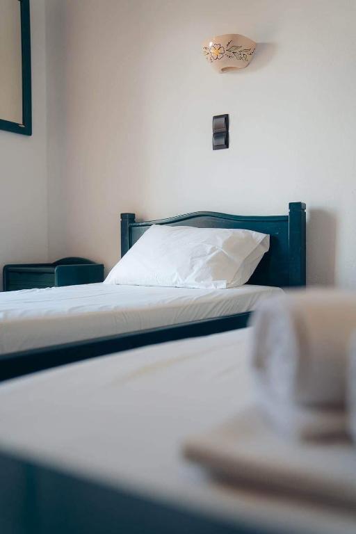 Postel nebo postele na pokoji v ubytování Oniropagida