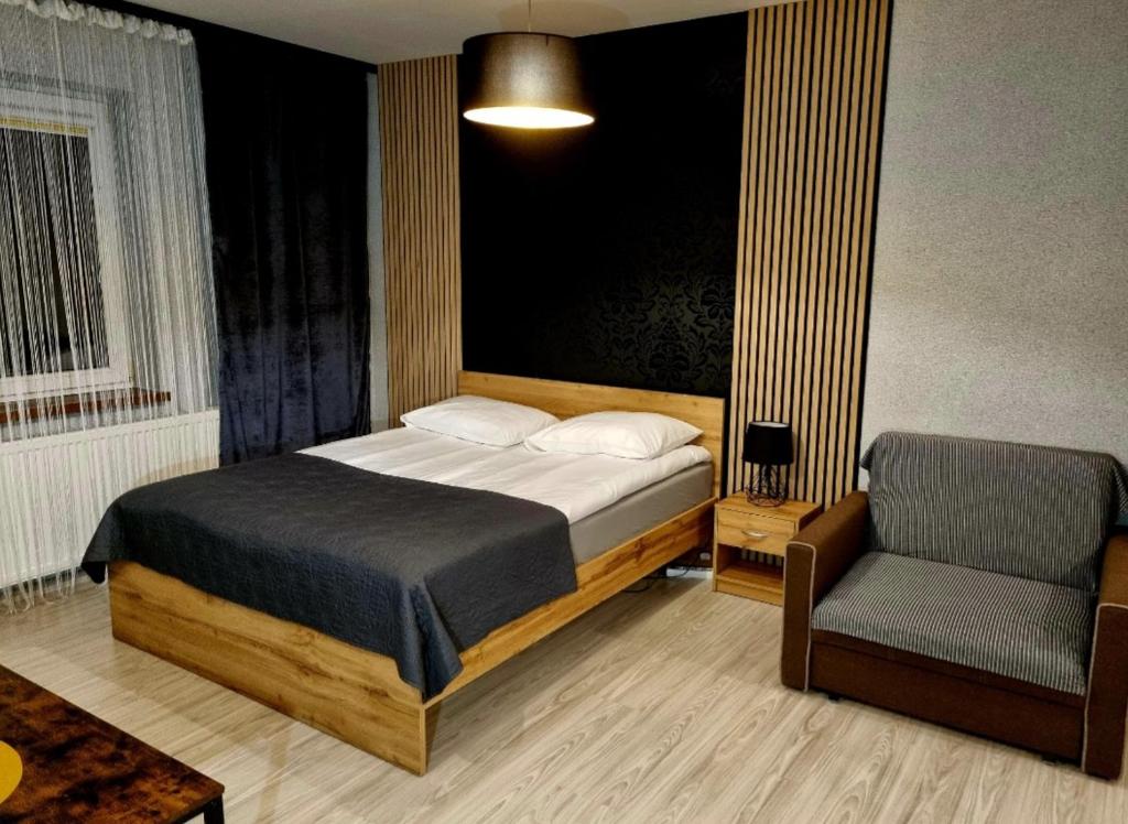 Posteľ alebo postele v izbe v ubytovaní Willa "Aparthause" E-Apartamenty