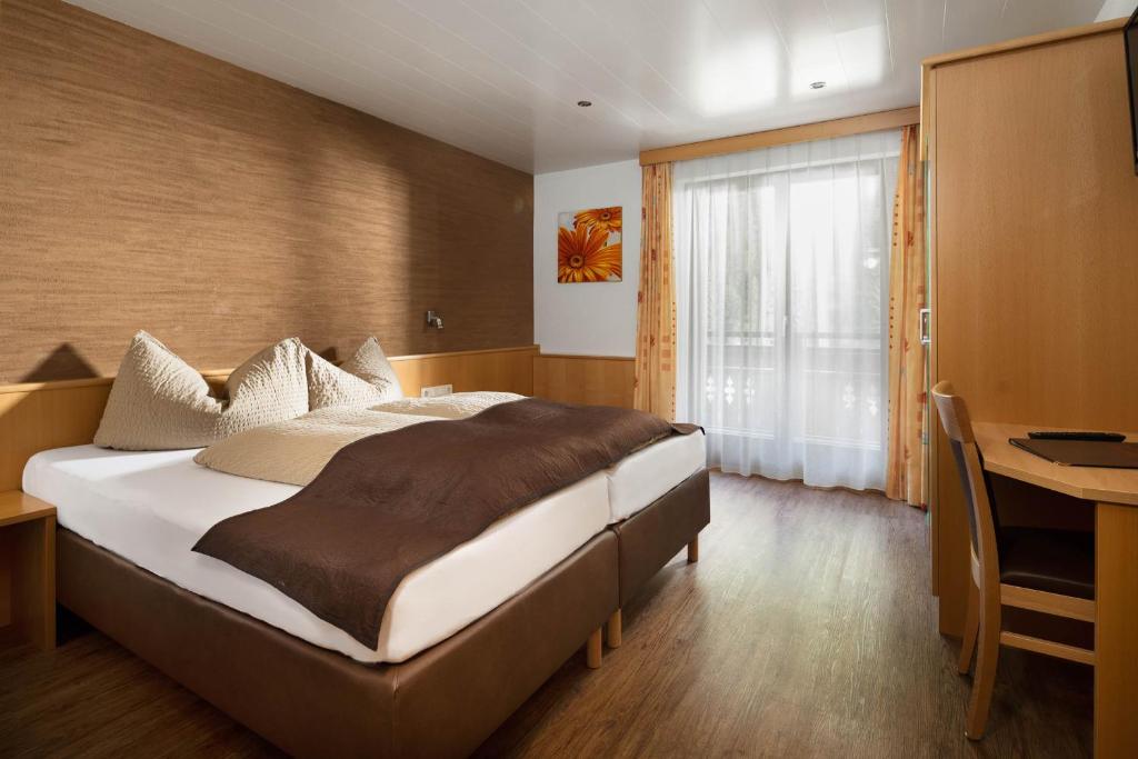 Postel nebo postele na pokoji v ubytování Haus Gafrina