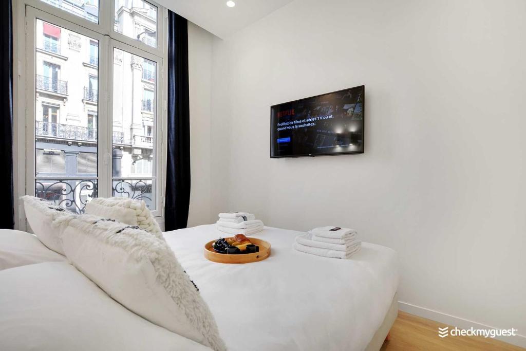 Televízia a/alebo spoločenská miestnosť v ubytovaní Charming apartment - 3BR-8P - Le Marais