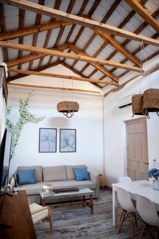 a living room with a couch and a table at Casas Rurales La Rinconá in Moral de Calatrava