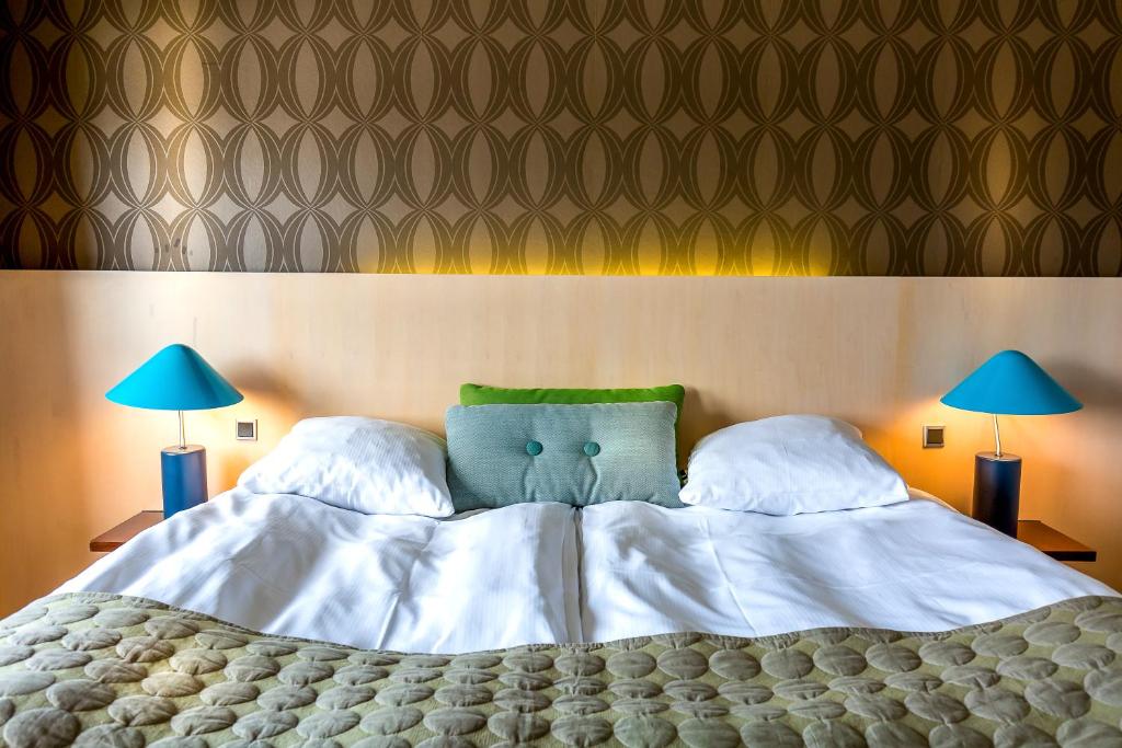 Postel nebo postele na pokoji v ubytování Hotel Lautrup Park
