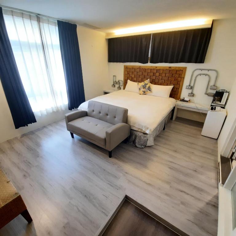 Postel nebo postele na pokoji v ubytování Lanhiwan Inn