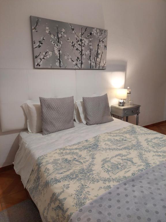 Letto o letti in una camera di Vivenda Rosa Lagos