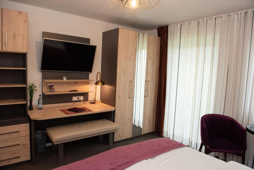 TV a/nebo společenská místnost v ubytování Apartments Amtzell, Selbst-Check-in