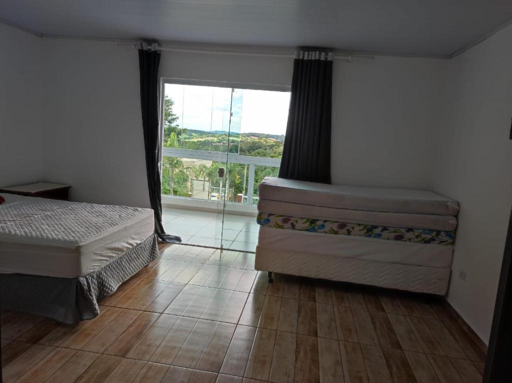 Postel nebo postele na pokoji v ubytování SITIO EM IBIUNA CONDOMINIO RECREIO VERDE Piscina Aquecida