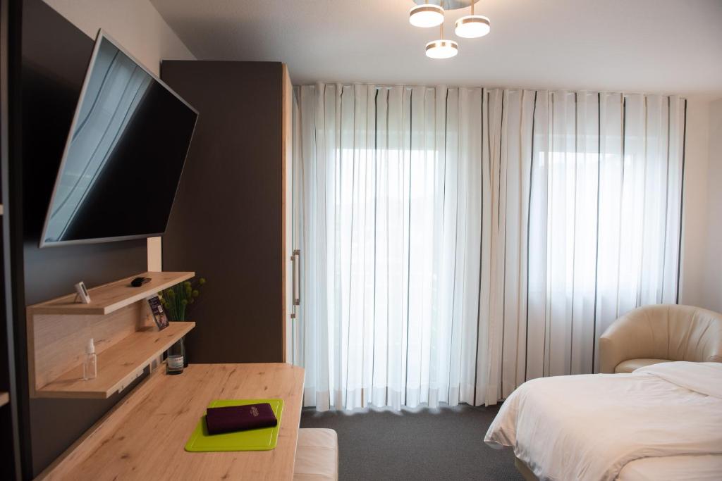 Postel nebo postele na pokoji v ubytování Apartments Amtzell, Selbst-Check-in