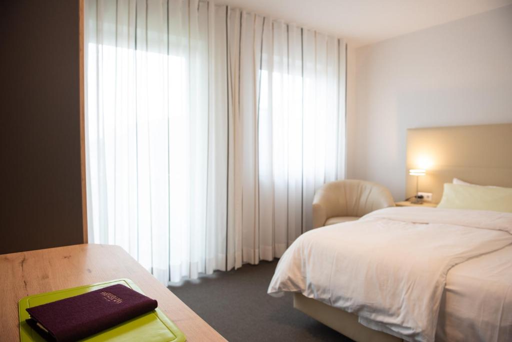 Postel nebo postele na pokoji v ubytování Apartments Amtzell, Selbst-Check-in