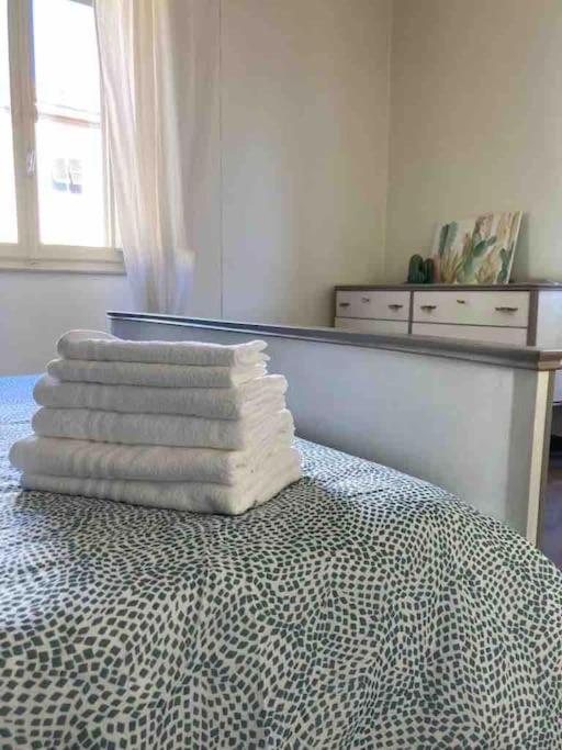 A bed or beds in a room at Casa Nina, intero appartamento