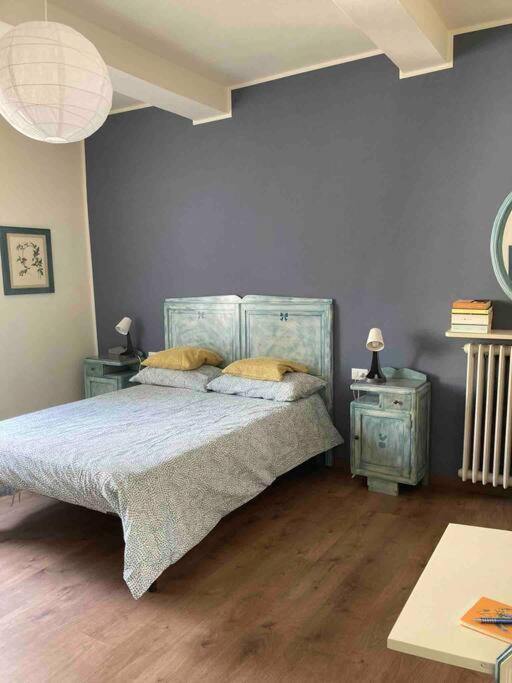 A bed or beds in a room at Casa Nina, intero appartamento