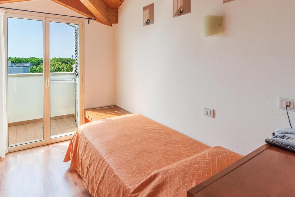 Postel nebo postele na pokoji v ubytování Hotel Escorial