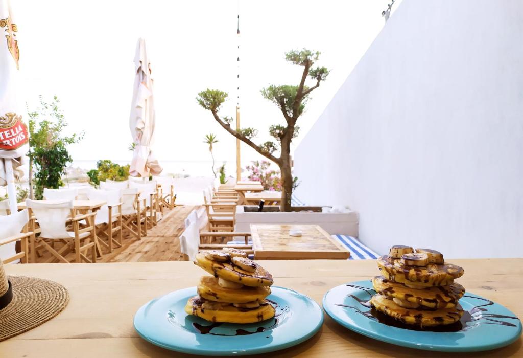 two blue plates of bananas on a table at Tonea's Houses in Himare