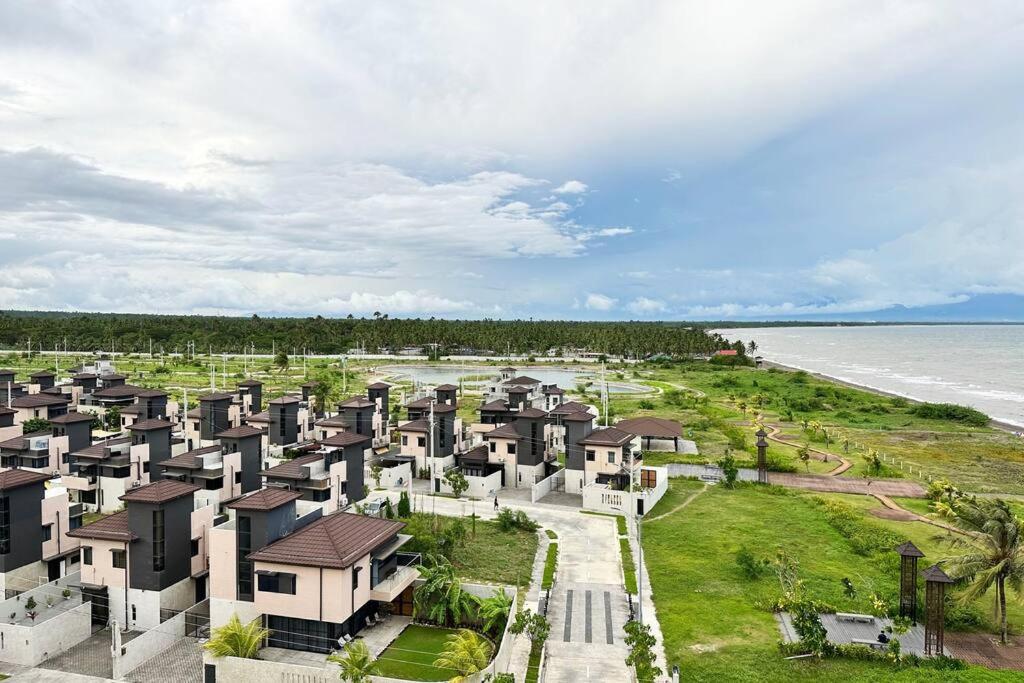 an aerial view of a resort near the ocean at Seafront OnCall - private jacuzzi with 4 cozy bedrooms in San Juan