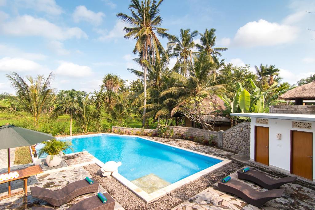 an image of a swimming pool at a villa at Gita Maha Ubud Hotel by Mahaputra-CHSE Certified in Ubud