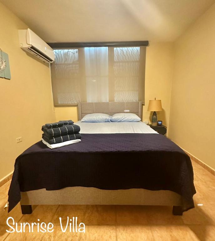 Postel nebo postele na pokoji v ubytování Sunrise Villa