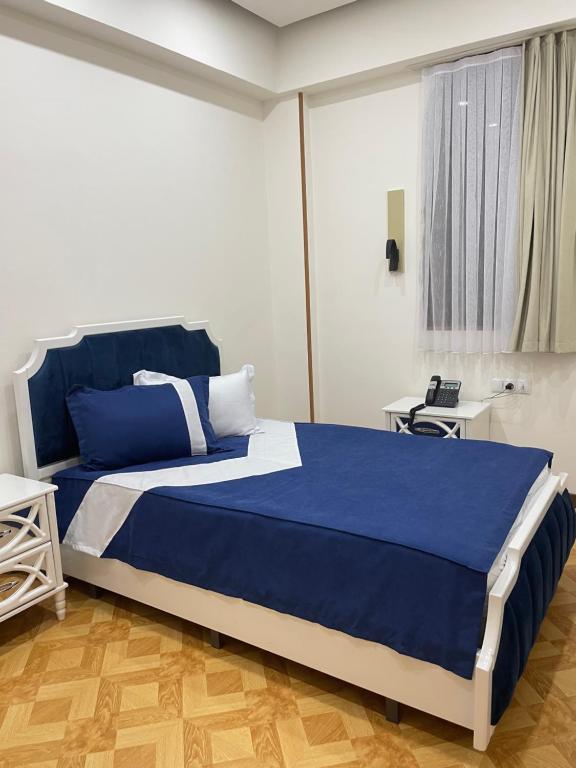 Postel nebo postele na pokoji v ubytování LUXIN