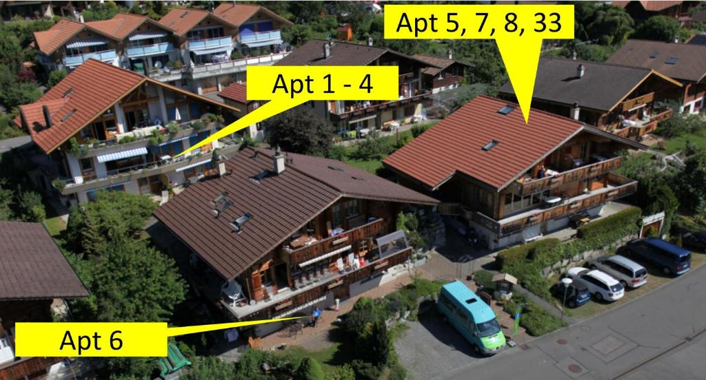 an aerial view of a house with roofs at Schwizi's Apartments in Ringgenberg