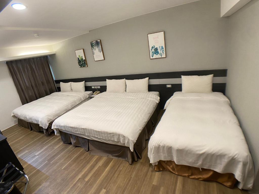 Postel nebo postele na pokoji v ubytování Bonjour Hotel