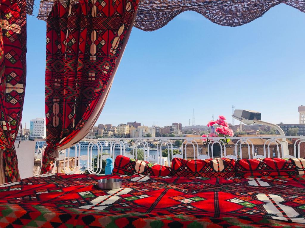 a room with a couch and a view of the city at Gamal Robob Nubian Guest House in Aswan