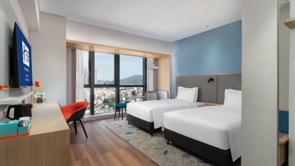 Postel nebo postele na pokoji v ubytování Holiday Inn Express Shunde Daliang by IHG