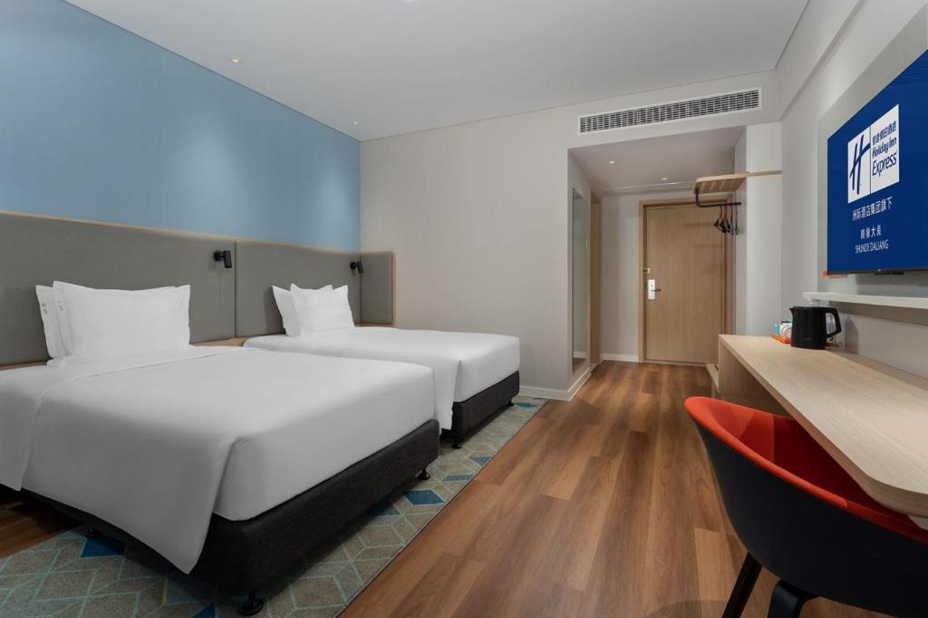 Postel nebo postele na pokoji v ubytování Holiday Inn Express Shunde Daliang by IHG