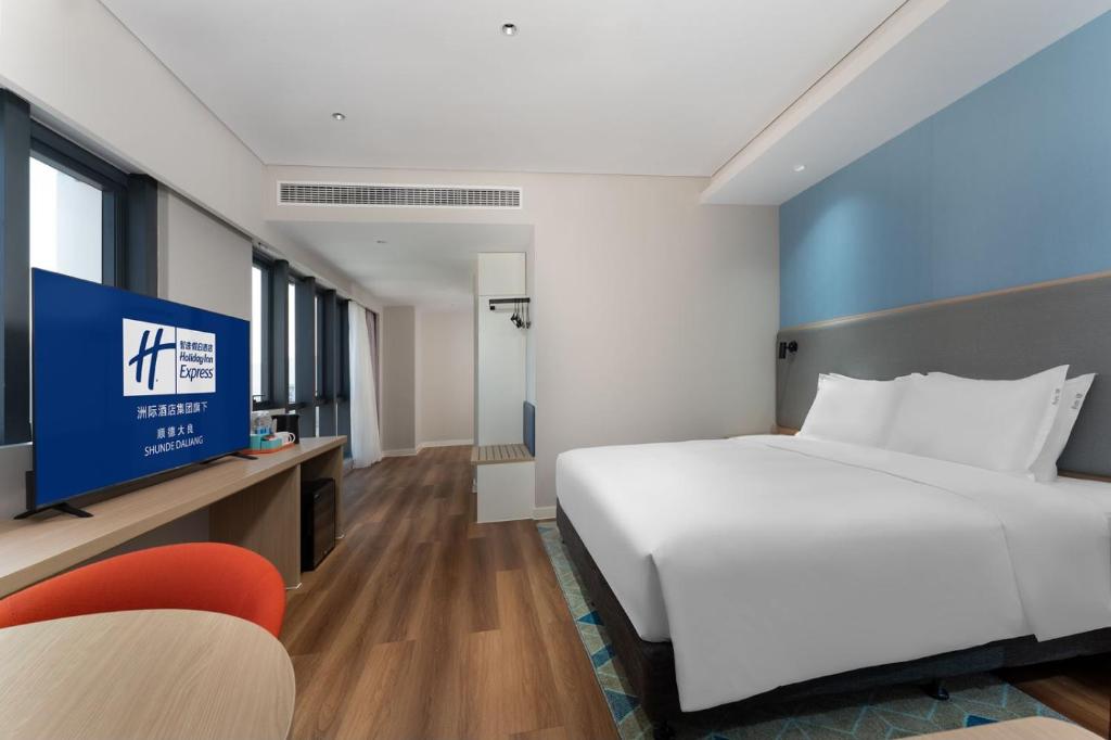 Postel nebo postele na pokoji v ubytování Holiday Inn Express Shunde Daliang by IHG