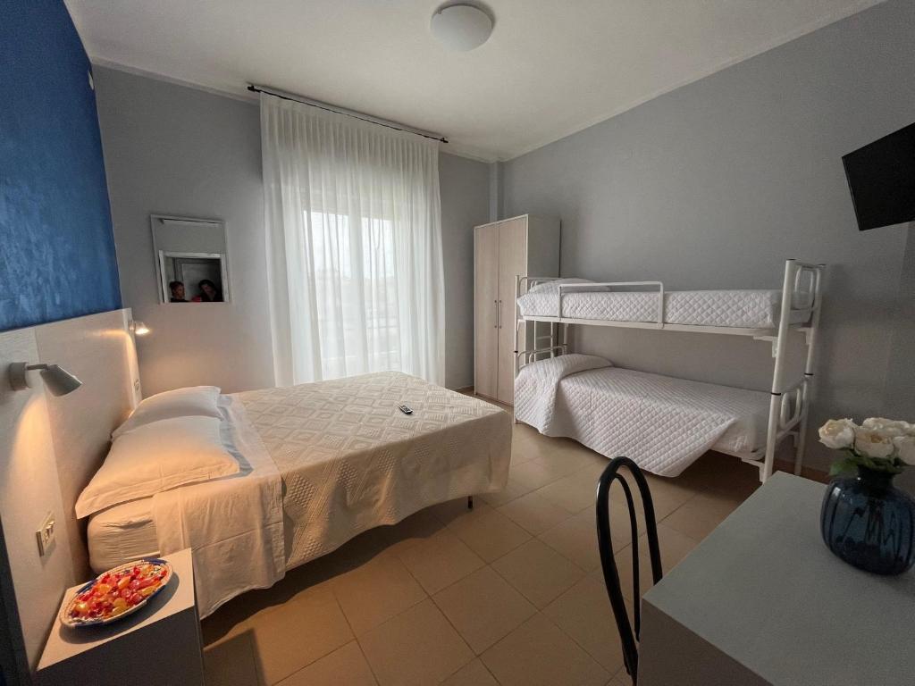Postel nebo postele na pokoji v ubytování Hotel Le Ali